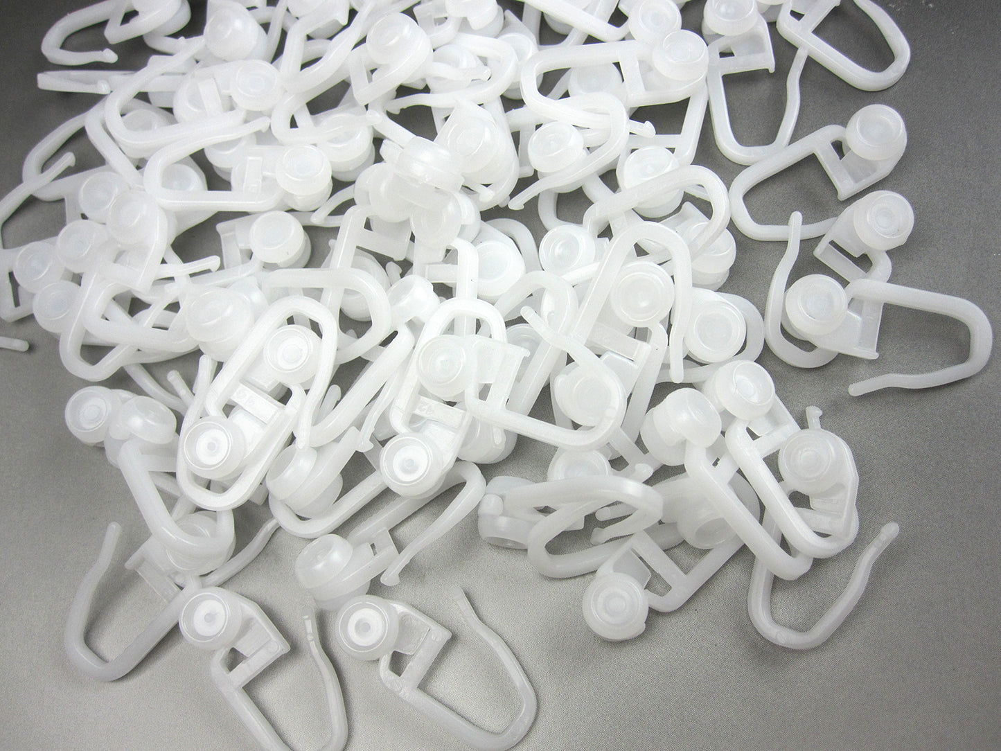 Gardinenrolle mit Faltenhaken – Innenlaufrolle, Rollringe Ø 8 mm halbrund, 100 Stück